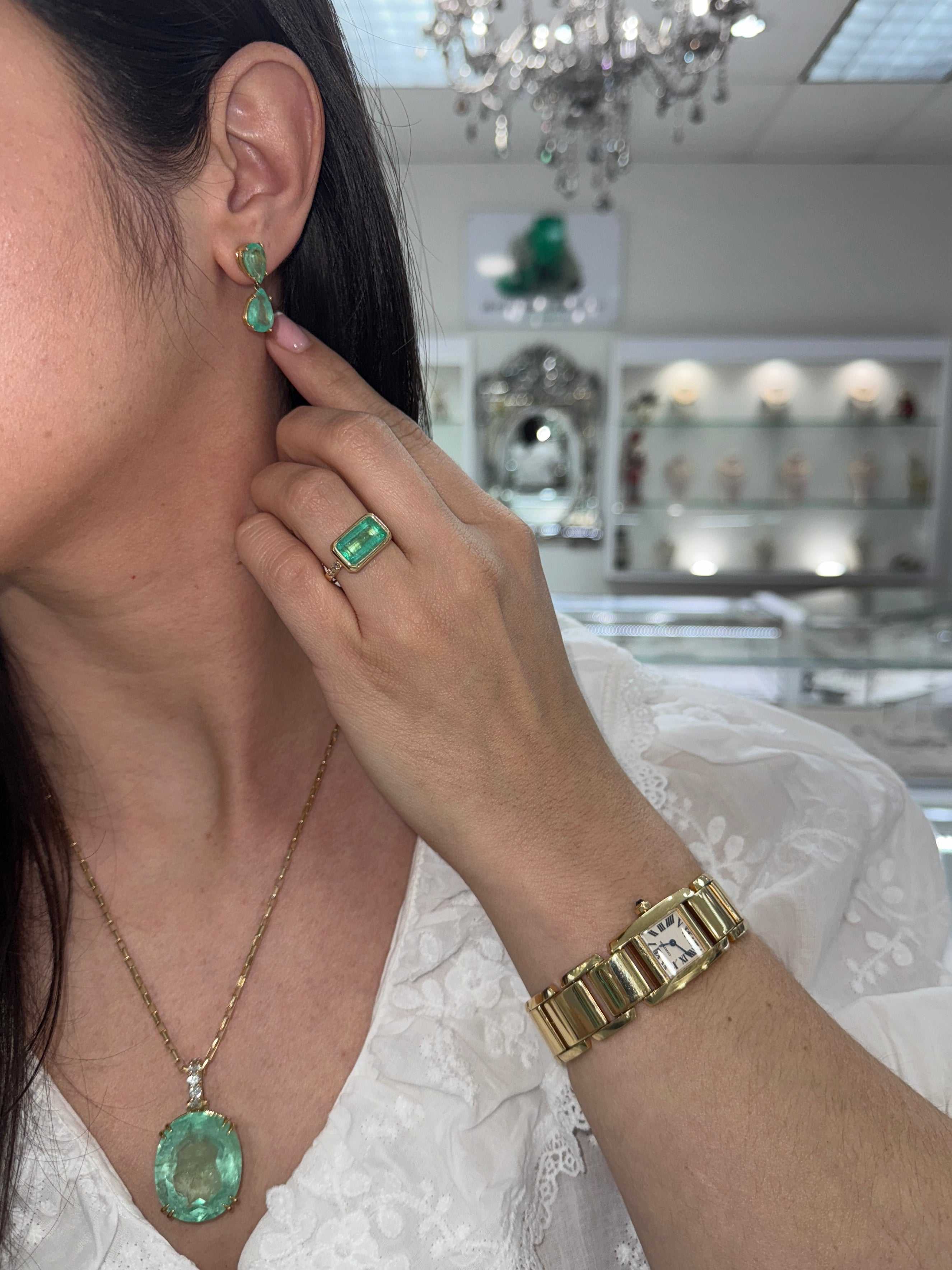 Natural Colombian emerald dangle earrings, 7.54tcw teardrop shape, set in 14K gold, by JR Colombian Emeralds.