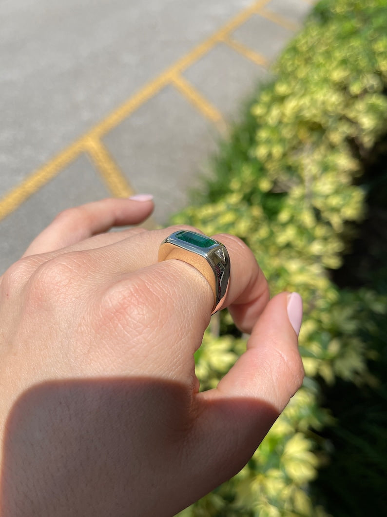 14K gold east-to-west emerald and diamond triangle ring with chunky design and rich green emeralds, featuring a 3.75 tcw gemstone.