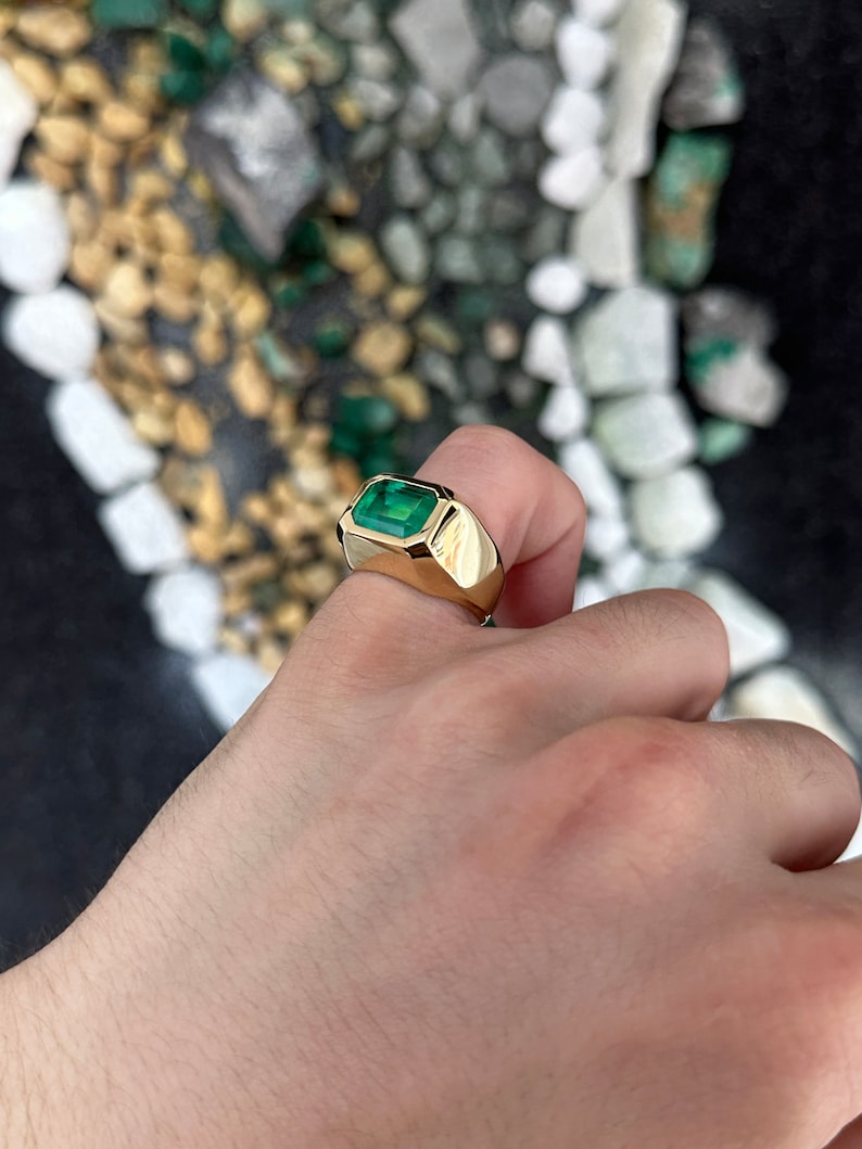 Men's 4.25 Carat emerald cut solitaire gold ring with east-west setting in 18K gold from Colombian Emerald.