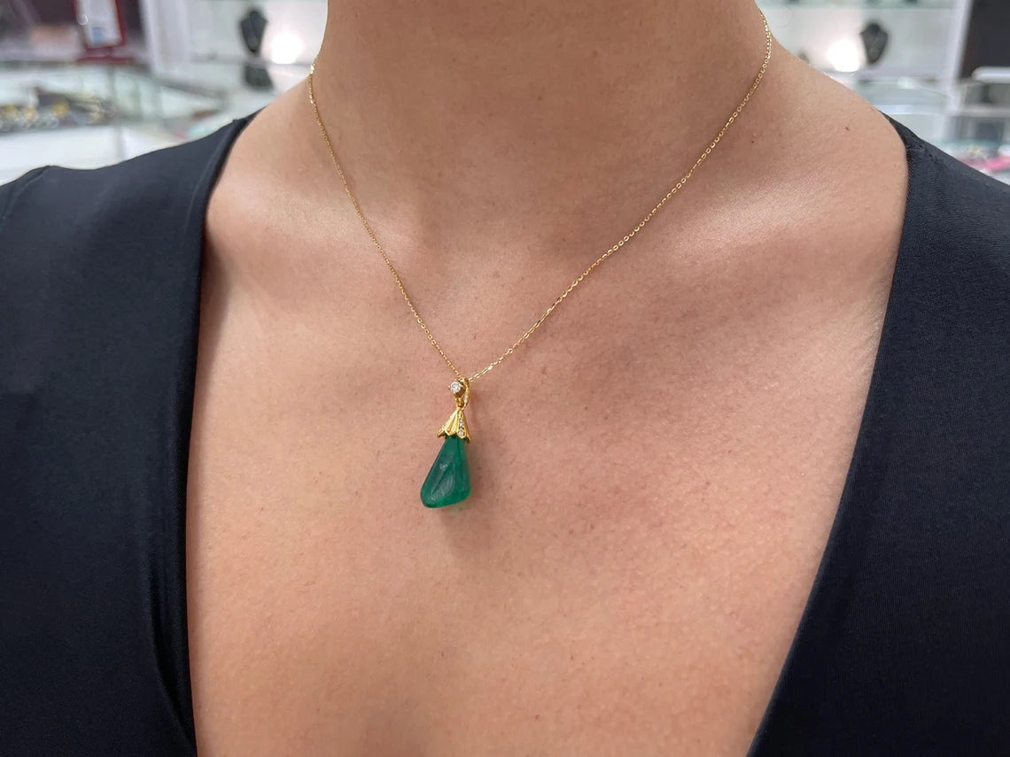 13.50 carat natural Colombian emerald baroque pendant with diamond accent
