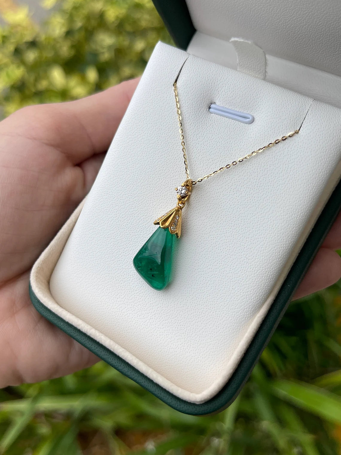 13.50 carat natural Colombian emerald baroque pendant with diamond accent