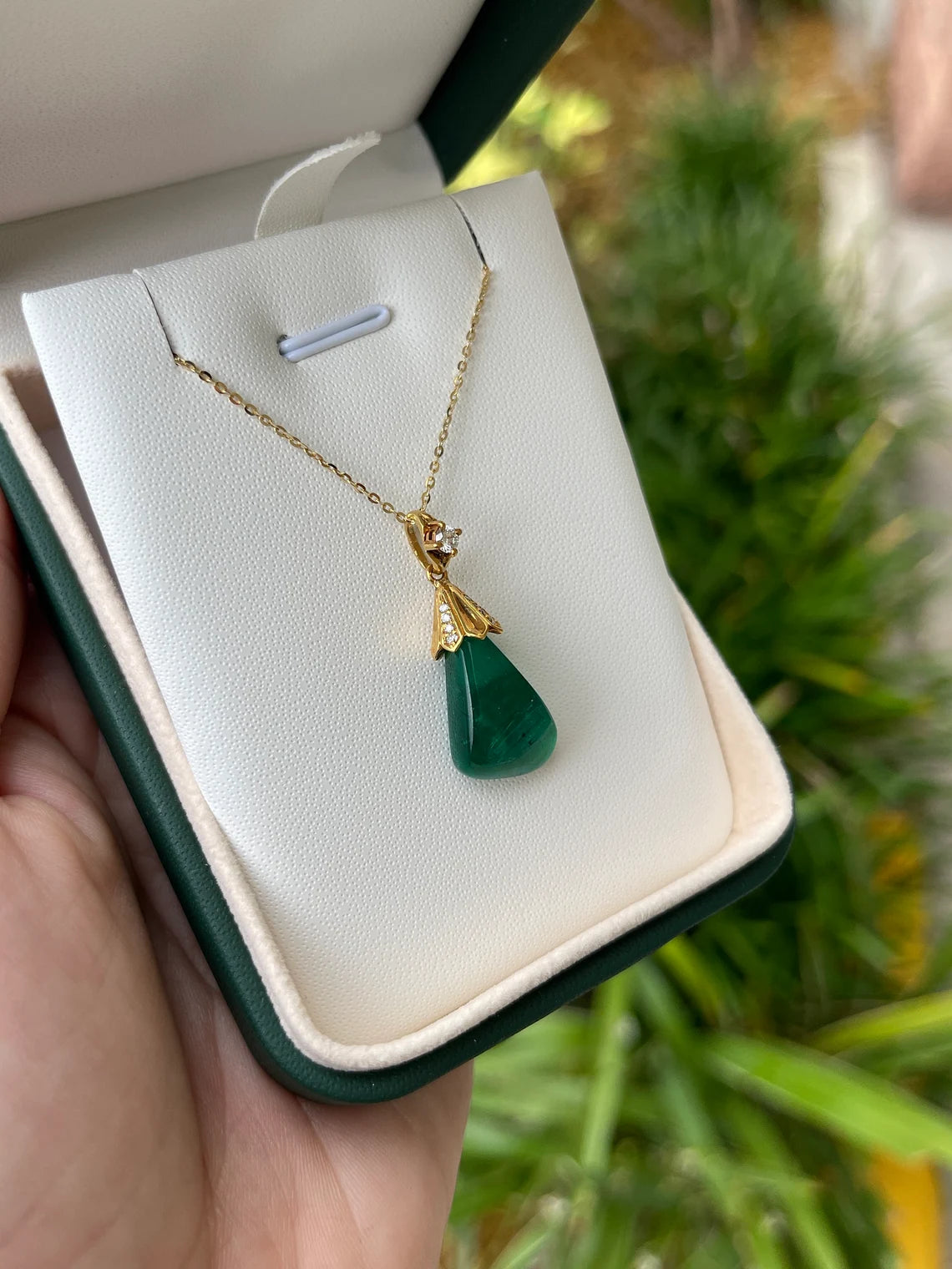 13.50 carat natural Colombian emerald baroque pendant with diamond accent
