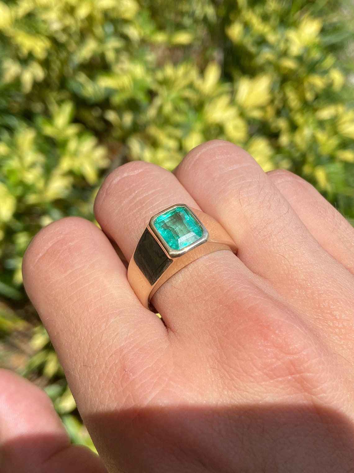 14K gold men's ring featuring a 2.80 carat Colombian emerald solitaire with a bezel setting, classic and elegant jewelry piece.