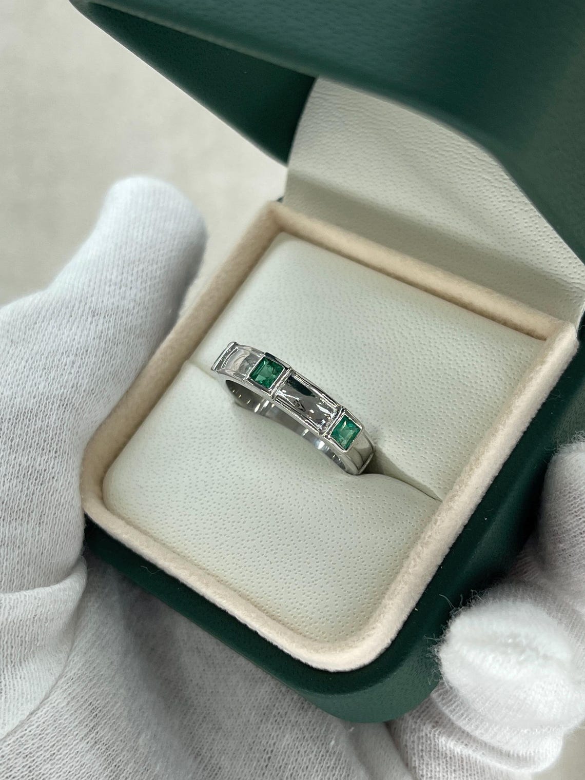 Men's 14K emerald three stone band ring with rich green princess-cut emeralds by JR Colombian Emeralds.
