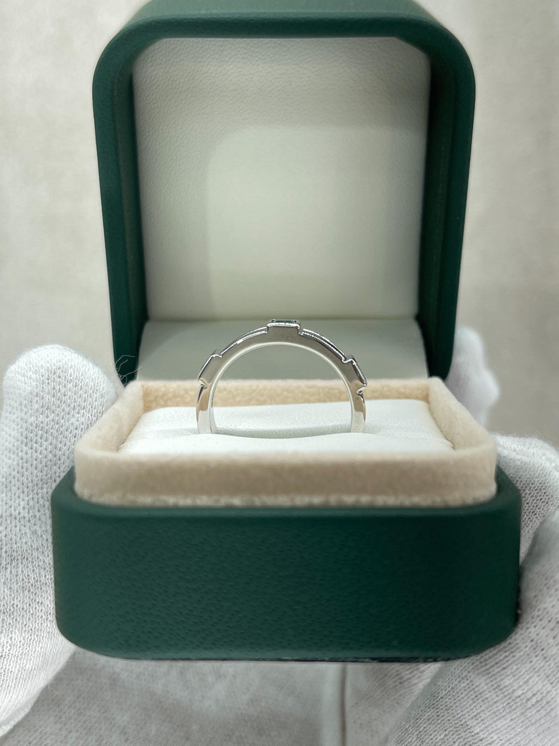 Men's 14K gold emerald three-stone band ring with rich green princess-cut emeralds by JR Colombian Emeralds.