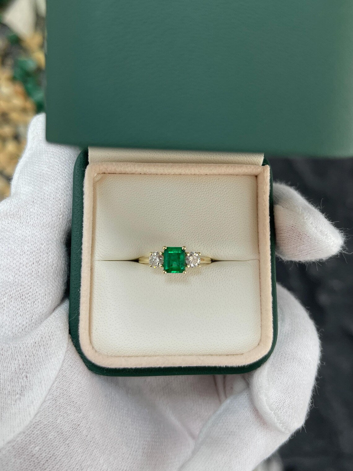 1.34ct Features Vivid Emerald Cut Emerald with Round Diamond Accents