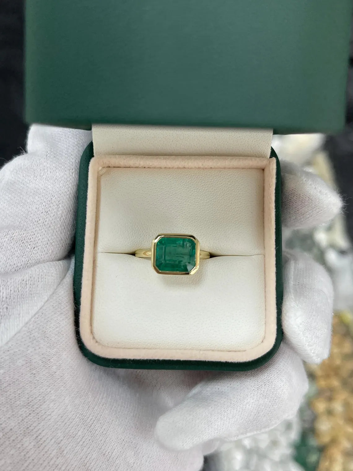 3.26ct Emerald Cut Solitaire Ring Features Lush Green Bezel Set Emerald