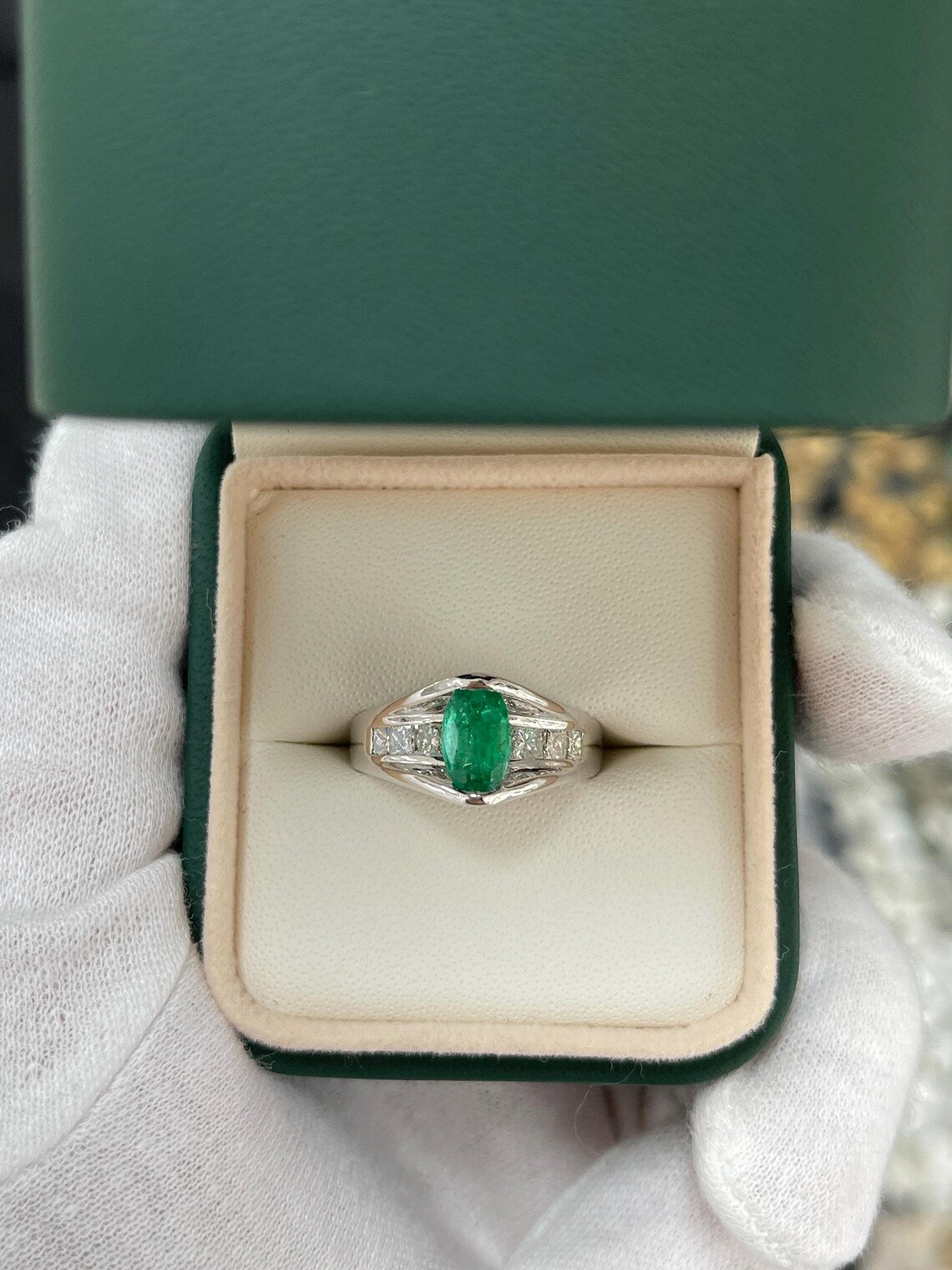 2.10 Carat Features Levitating Oval Emerald with Princess Diamond Row