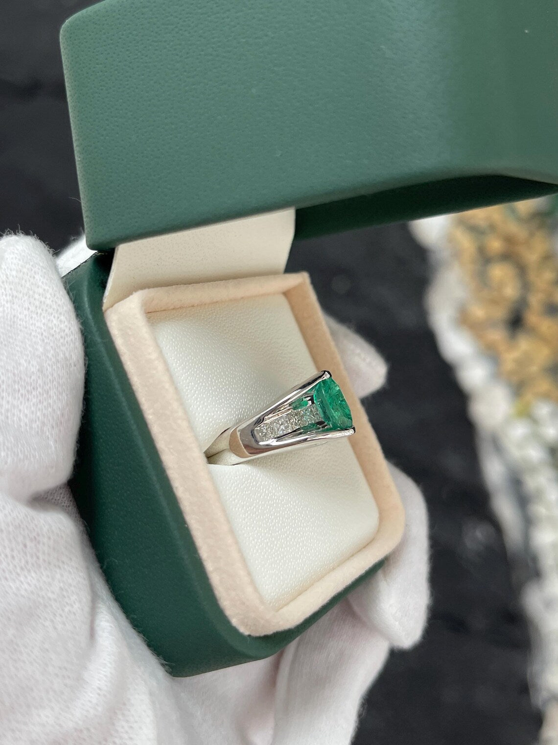 2.10 Carat Features Levitating Oval Emerald with Princess Diamond Row