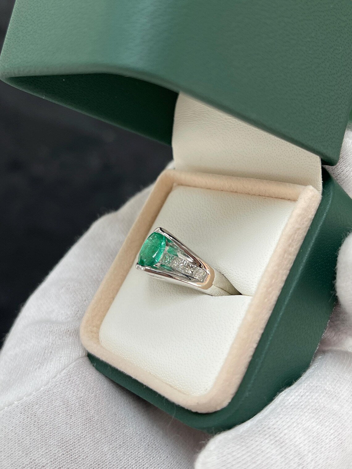 2.10 Carat Features Levitating Oval Emerald with Princess Diamond Row
