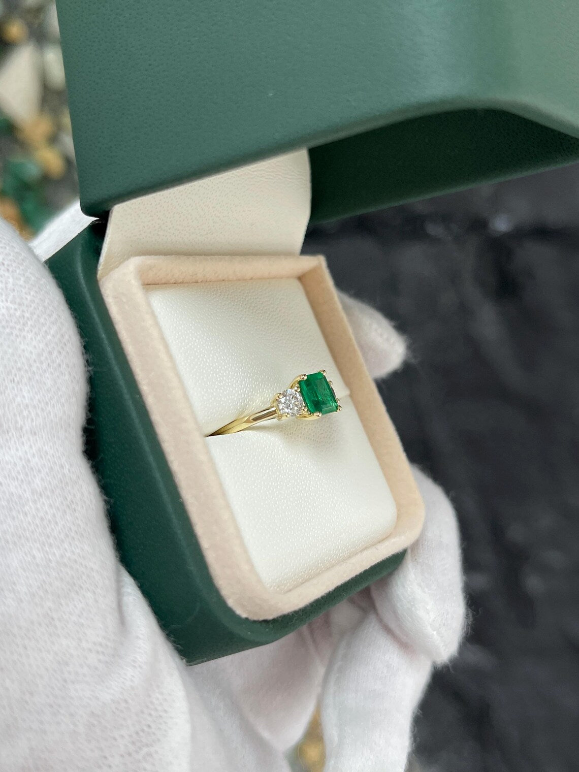 1.34ct Features Vivid Emerald Cut Emerald with Round Diamond Accents