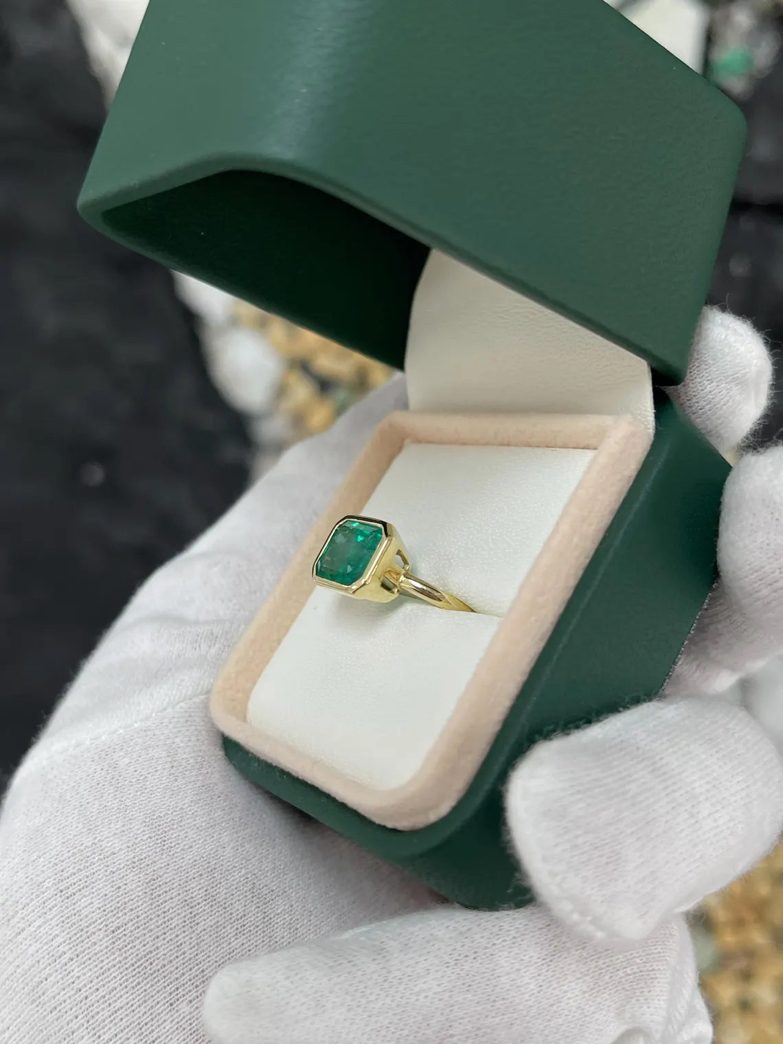 3.26ct Emerald Cut Solitaire Ring Features Lush Green Bezel Set Emerald