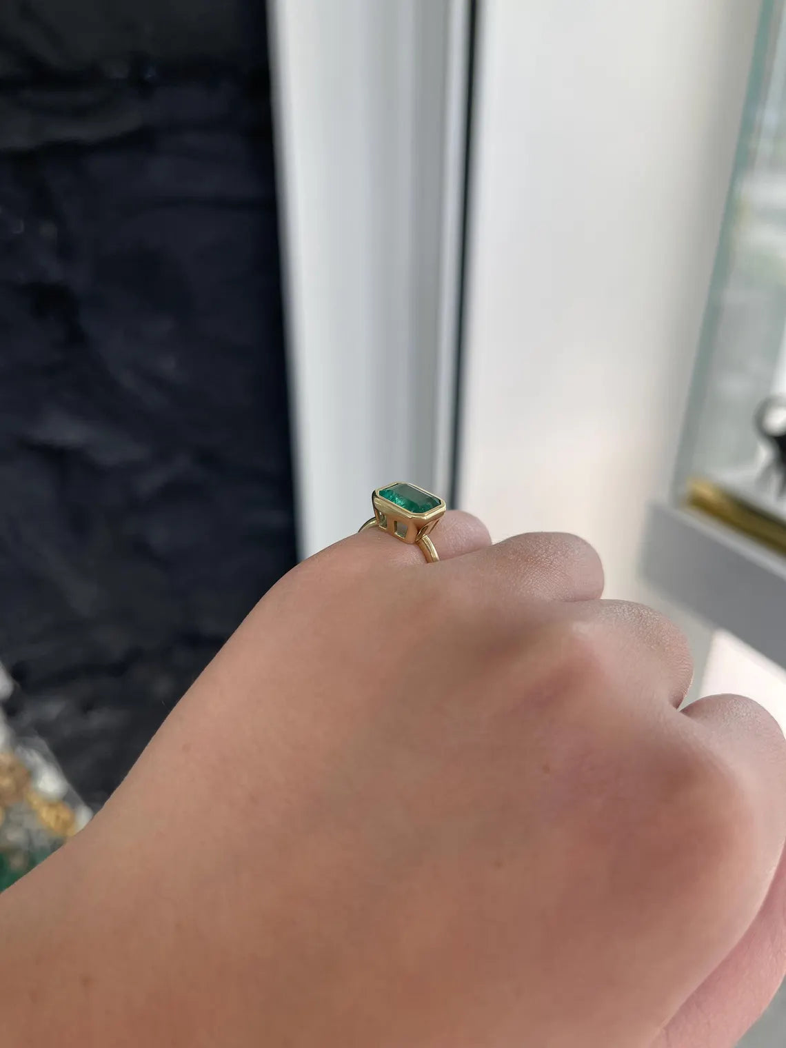 3.26ct Emerald Cut Solitaire Ring Features Lush Green Bezel Set Emerald