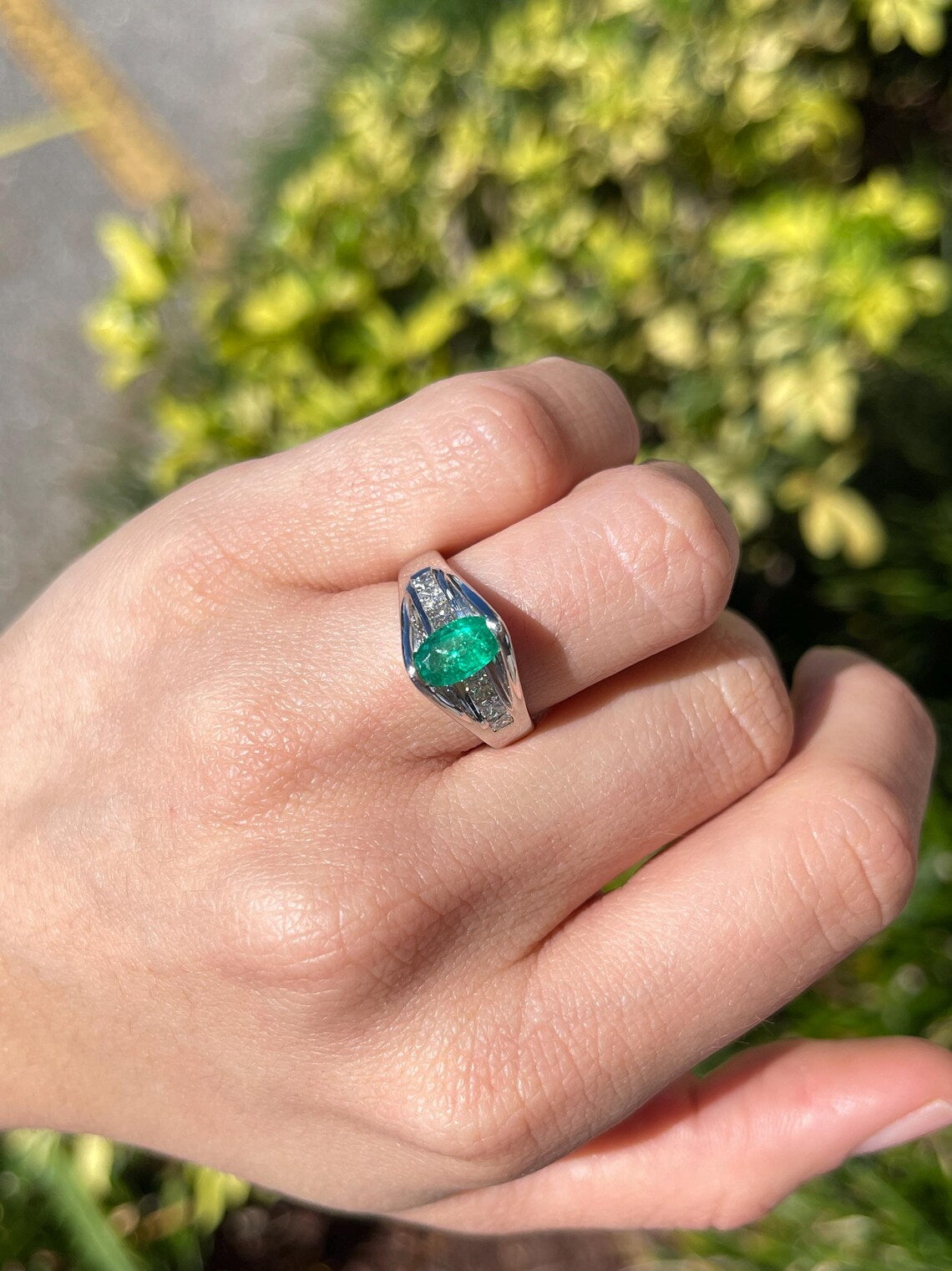 2.10 Carat Features Levitating Oval Emerald with Princess Diamond Row