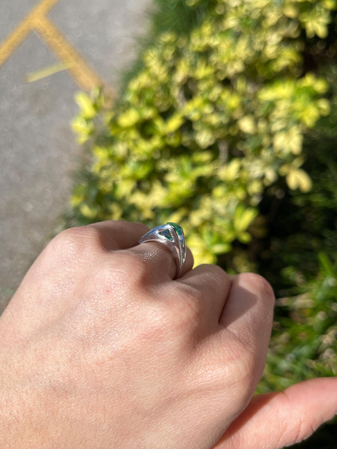 2.10 Carat Features Levitating Oval Emerald with Princess Diamond Row