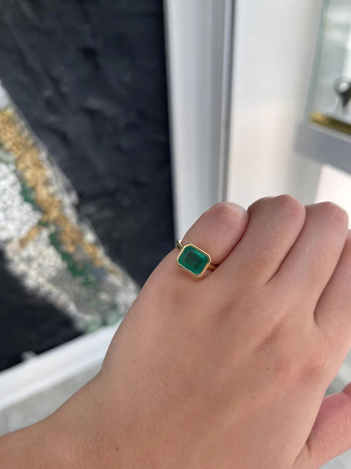 3.26ct Emerald Cut Solitaire Ring Features Lush Green Bezel Set Emerald