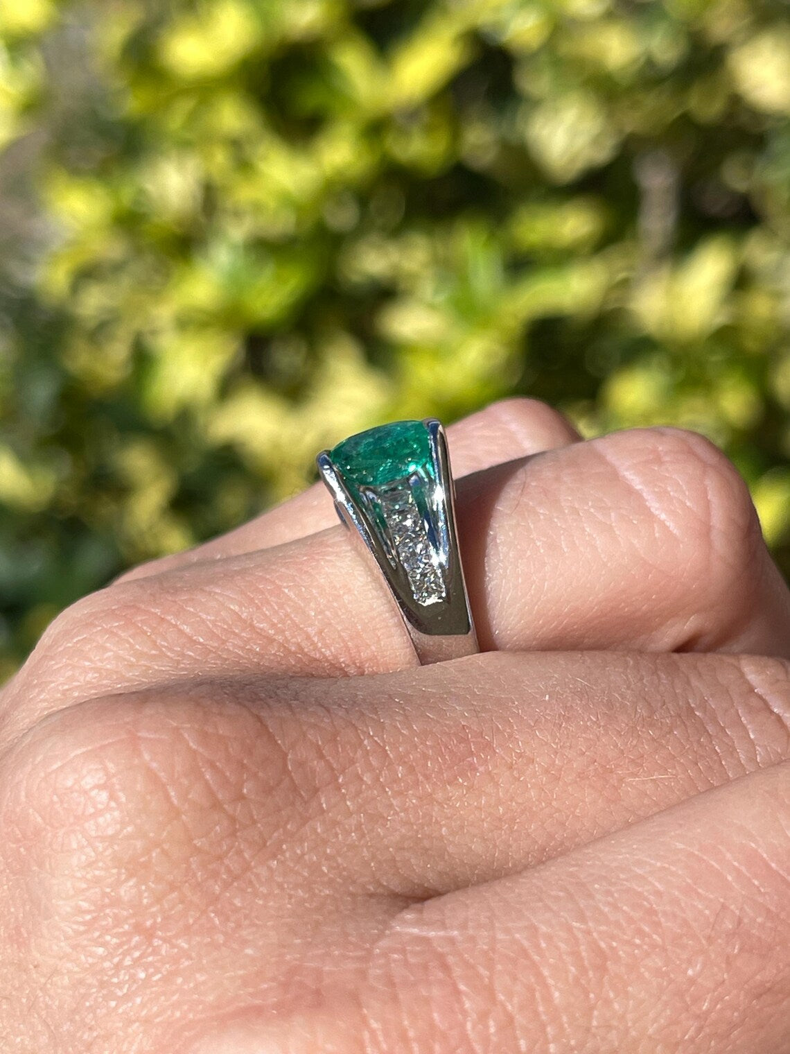2.10 Carat Features Levitating Oval Emerald with Princess Diamond Row