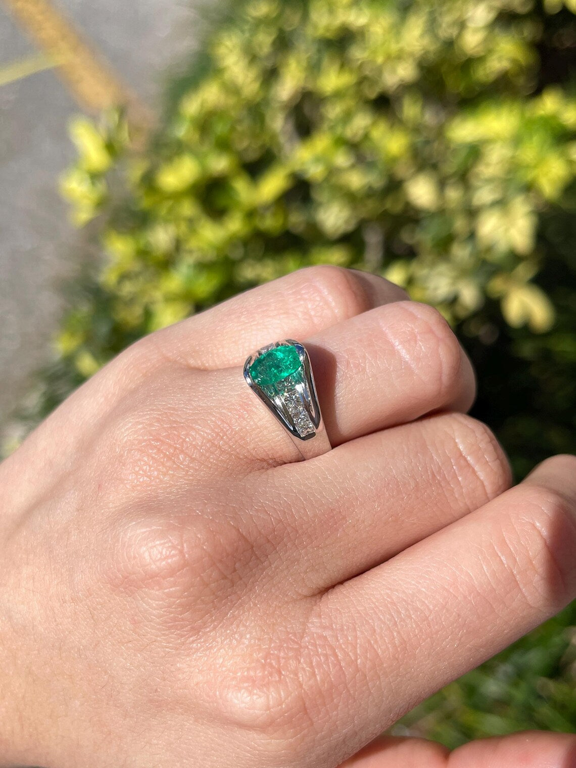 2.10 Carat Features Levitating Oval Emerald with Princess Diamond Row