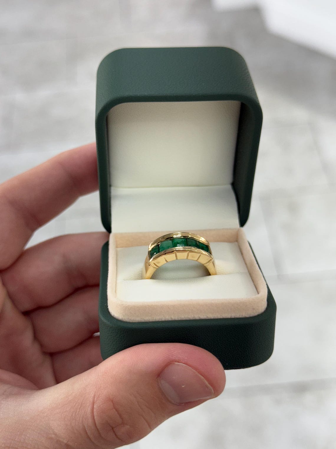 Men's 3.0 carat emerald cut emerald band ring in 14K gold with channel setting by JR Colombian Emeralds.