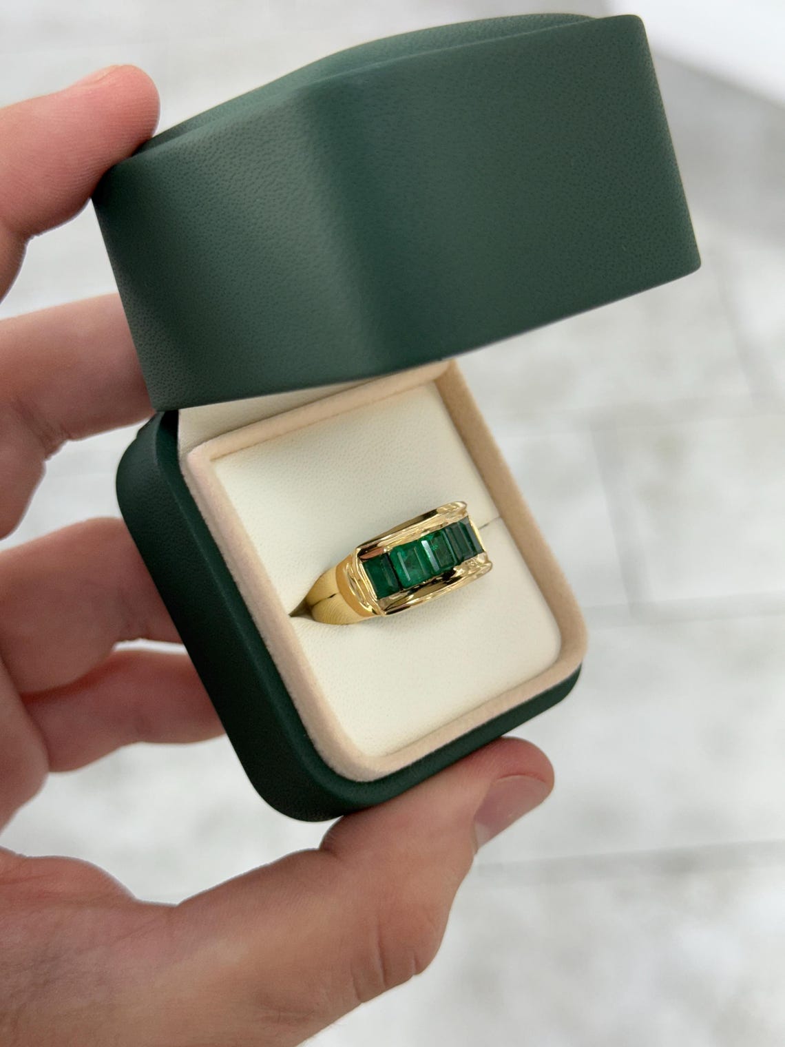 Men's 3.0 carat emerald cut emerald band ring in 14K gold with channel setting by JR Colombian Emeralds.