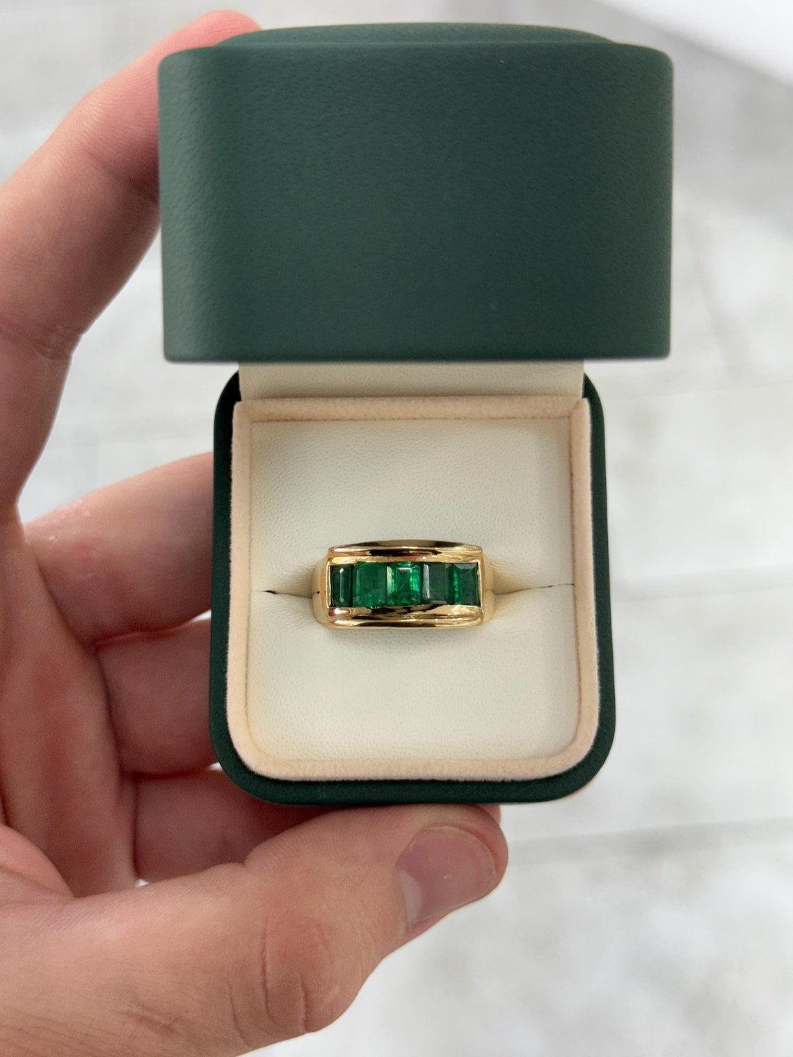 Men's 3.0 Carat emerald cut emerald band ring in 14K gold with channel setting, rich green color, by JR Colombian Emeralds.