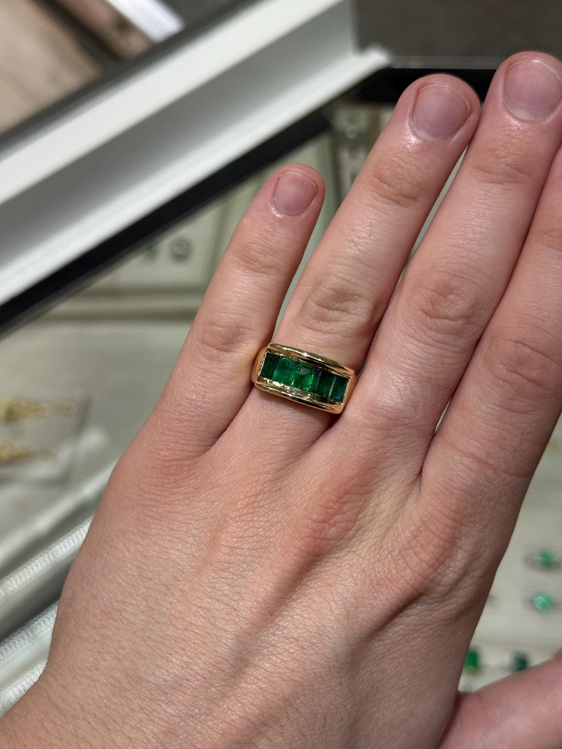 Men's 3.0 carat emerald cut emerald band ring in 14K gold with channel setting, rich green gemstone from JR Colombian Emeralds.