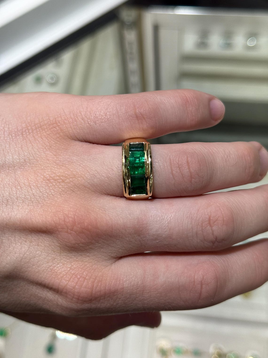 Men's 3.0 Carat emerald cut emerald band ring in 14K gold with channel setting, rich green color, by JR Colombian Emeralds.