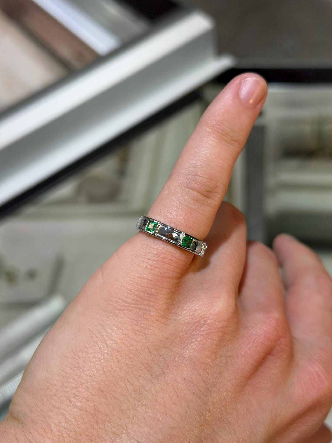 Men's 14K gold emerald three-stone band ring with bezel setting and rich green princess-cut emeralds by JR Colombian Emeralds.