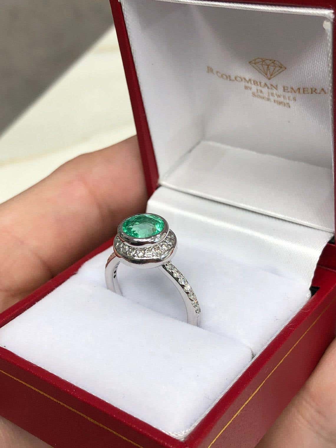 1.60 Carat round Colombian emerald diamond halo engagement ring in 14K gold by JR Colombian Emeralds, showcasing a stunning central emerald.