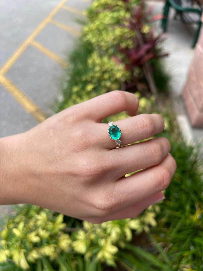 14K gold solitaire ring with 2.60 carat oval emerald and diamonds in a three-stone prong setting by JR Colombian Emeralds.