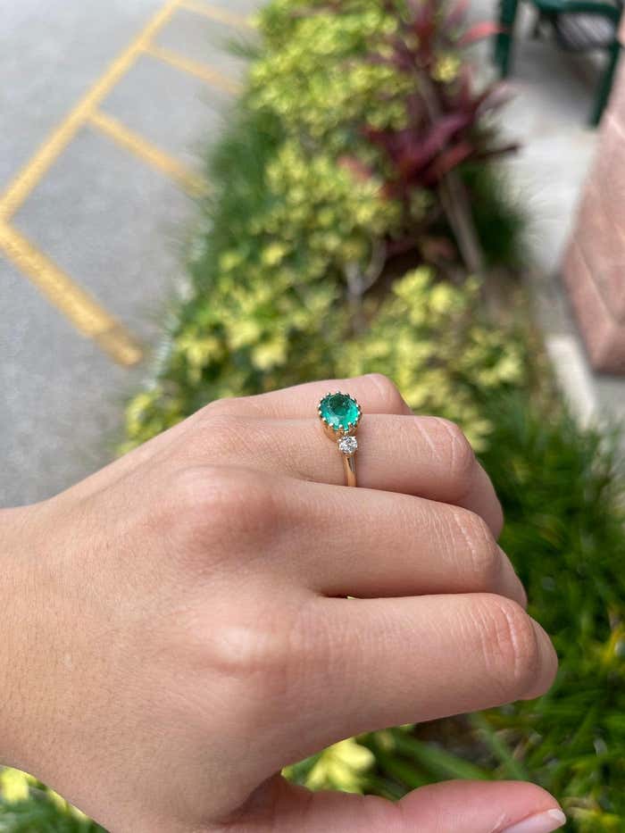 JR Colombian Emeralds 2.60 Carat Oval Emerald Diamond Solitaire Ring in 14K gold with three-stone prong setting and classic green color.