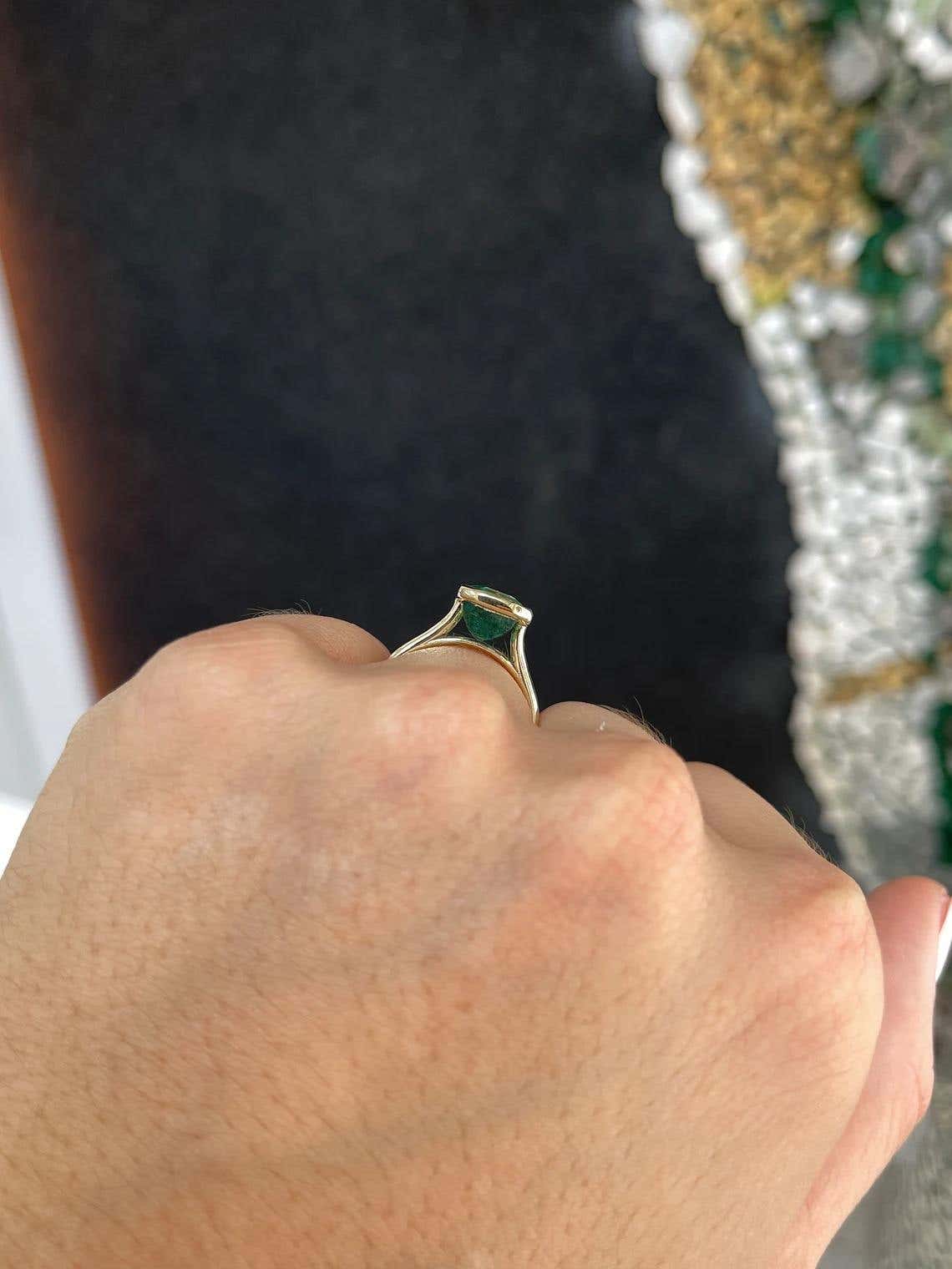 14K gold emerald engagement ring with a 4.76ct natural emerald cut bezel solitaire in blue-green from JR Colombian Emeralds.