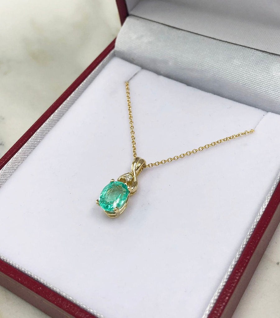 14K Oval Emerald Pendant with Round Diamond Accent