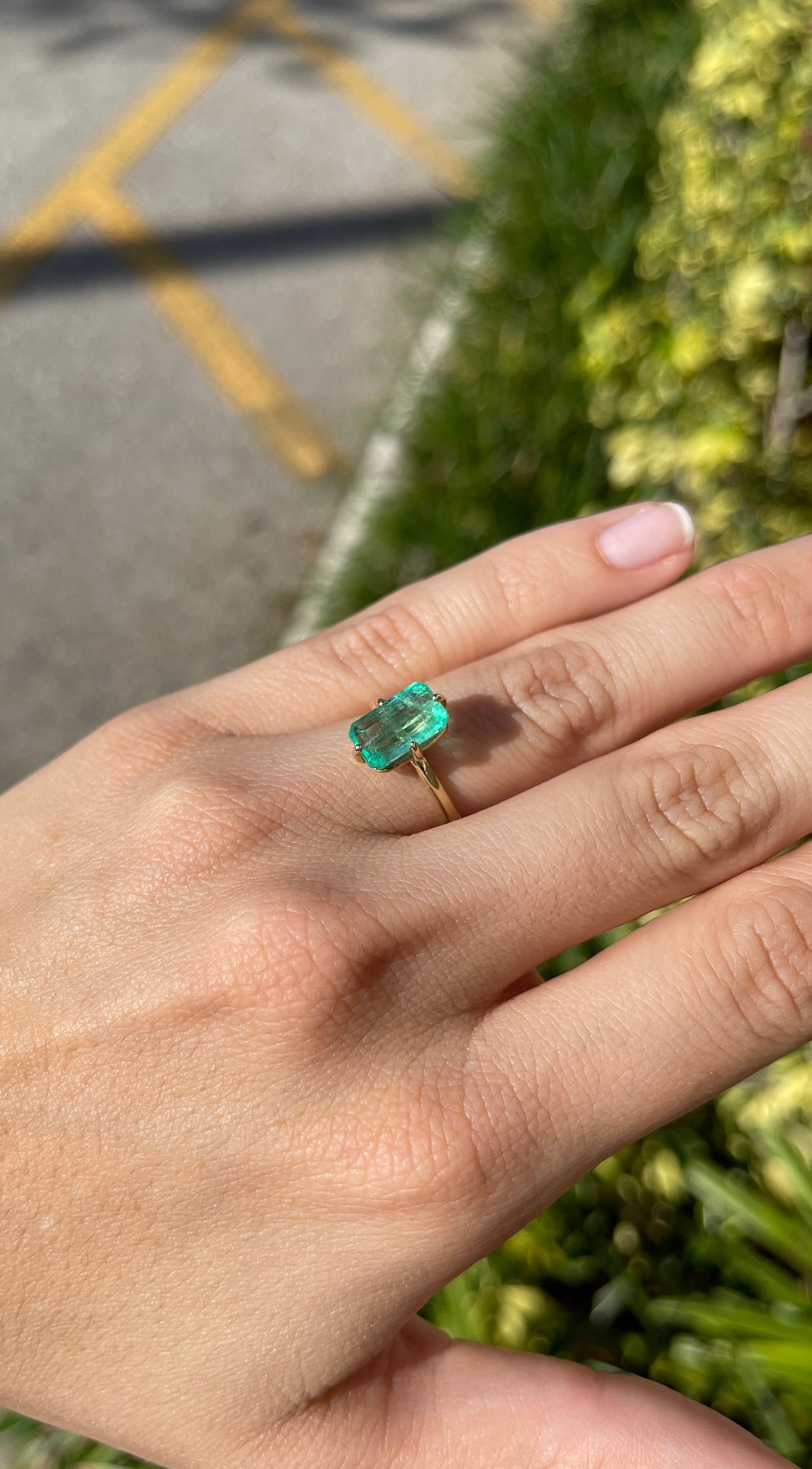 3.10 carat Colombian emerald solitaire engagement ring with 14K gold setting from JR Colombian Emeralds, showcasing the vibrant green gemstone.