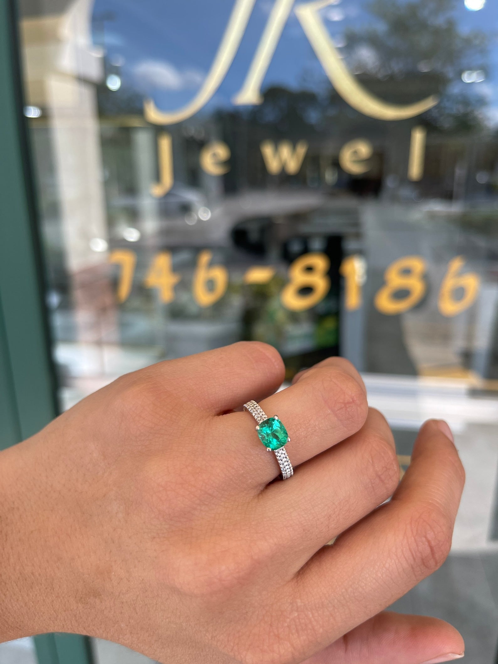 14K gold engagement ring with a 1.75 carat cushion cut Colombian emerald, prong-set, from JR Colombian Emeralds.
