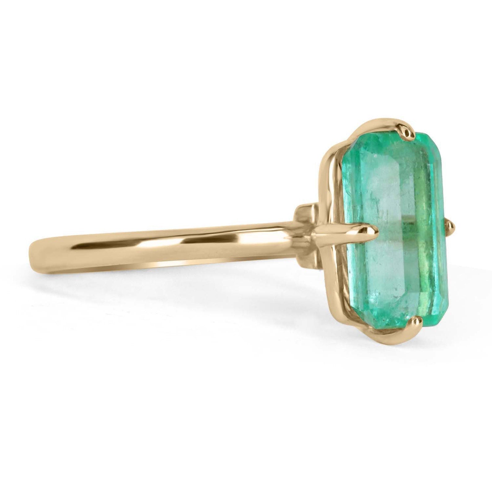 3.10 carat Colombian emerald solitaire engagement ring in 14K gold with a compass design, by JR Colombian Emeralds.