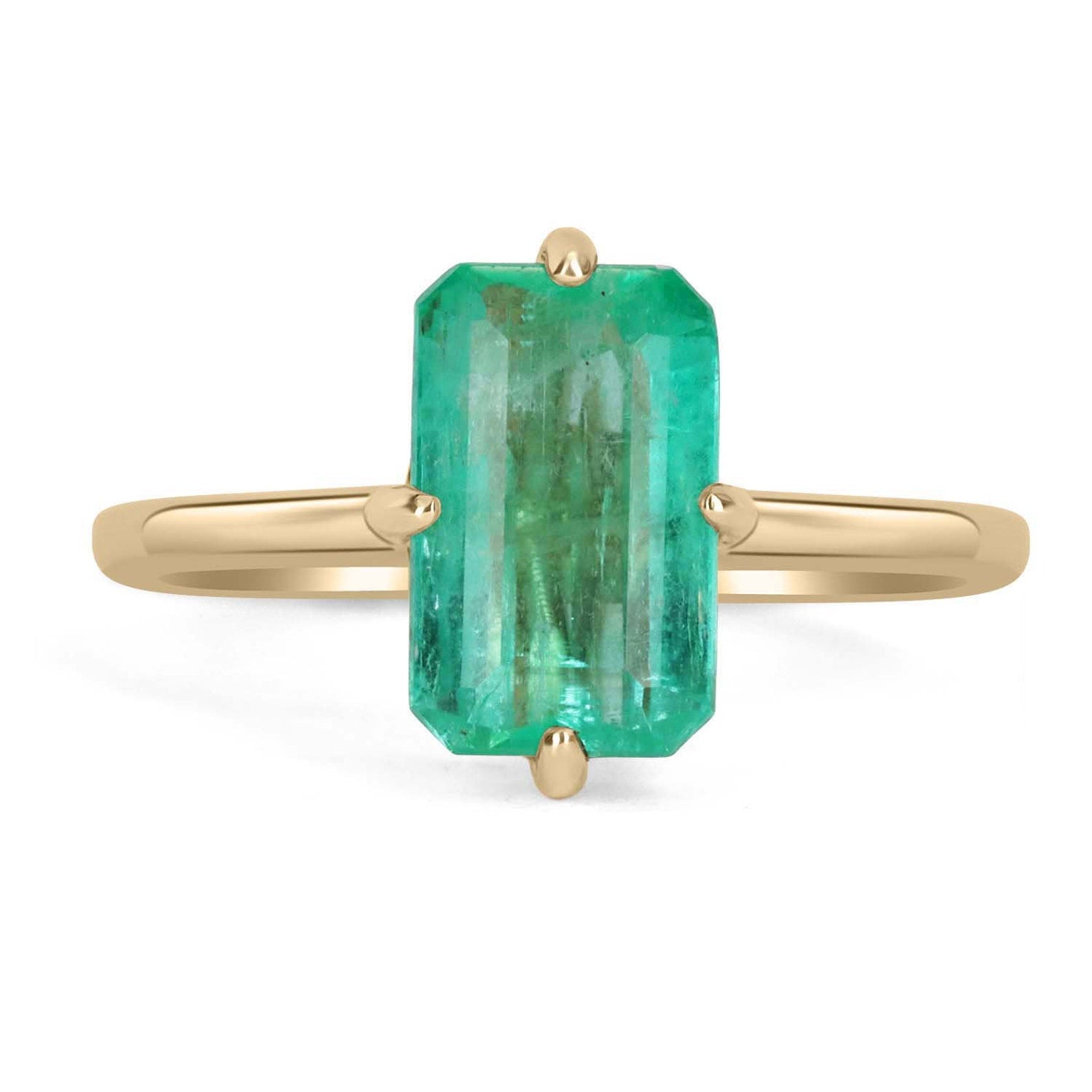 3.10 carat Colombian emerald solitaire engagement ring with 14K gold setting by JR Colombian Emeralds, featuring a vibrant green emerald centerpiece.