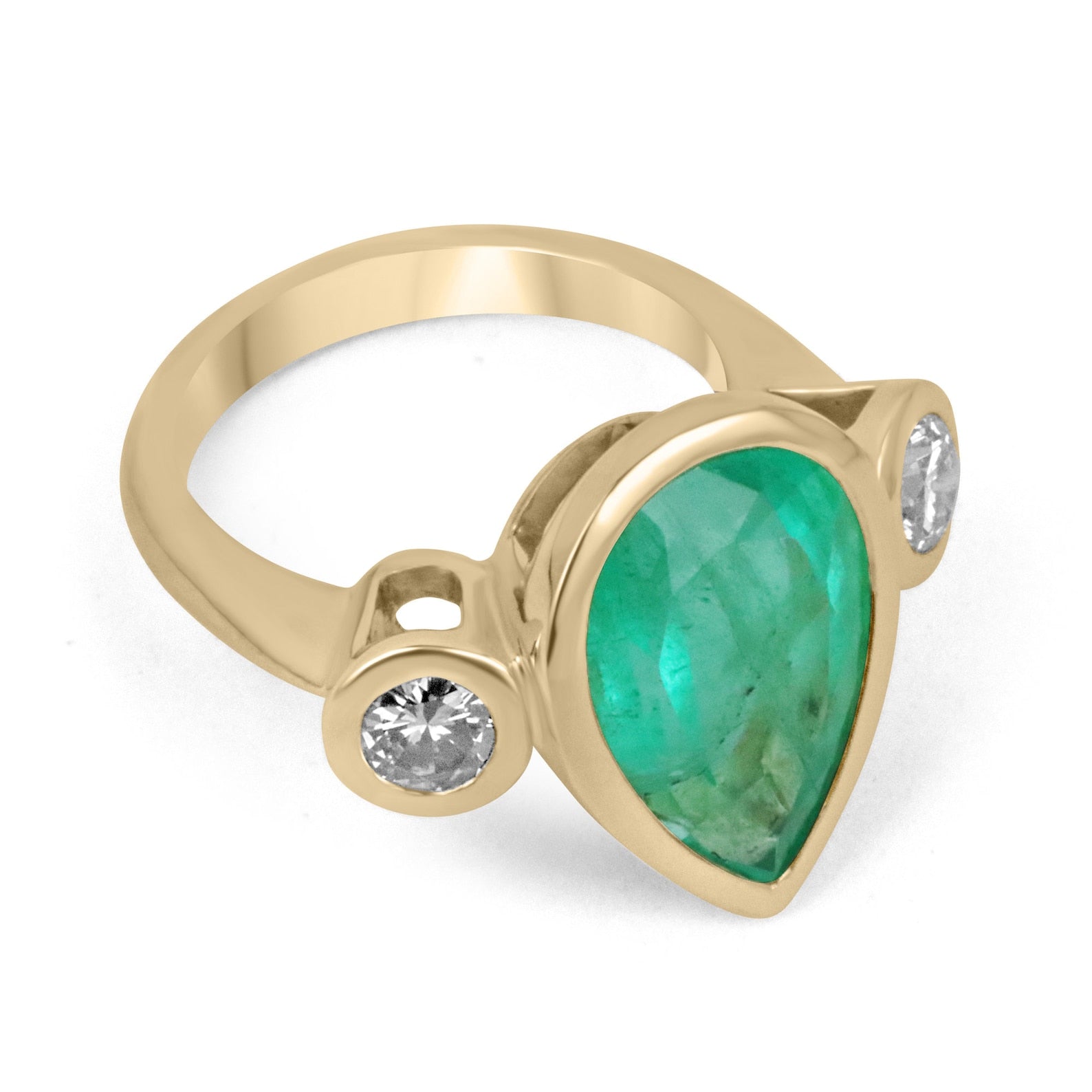 Pear-shaped Colombian emerald and diamond three-stone ring set in 18K gold, bezel setting, from JR Colombian Emeralds.