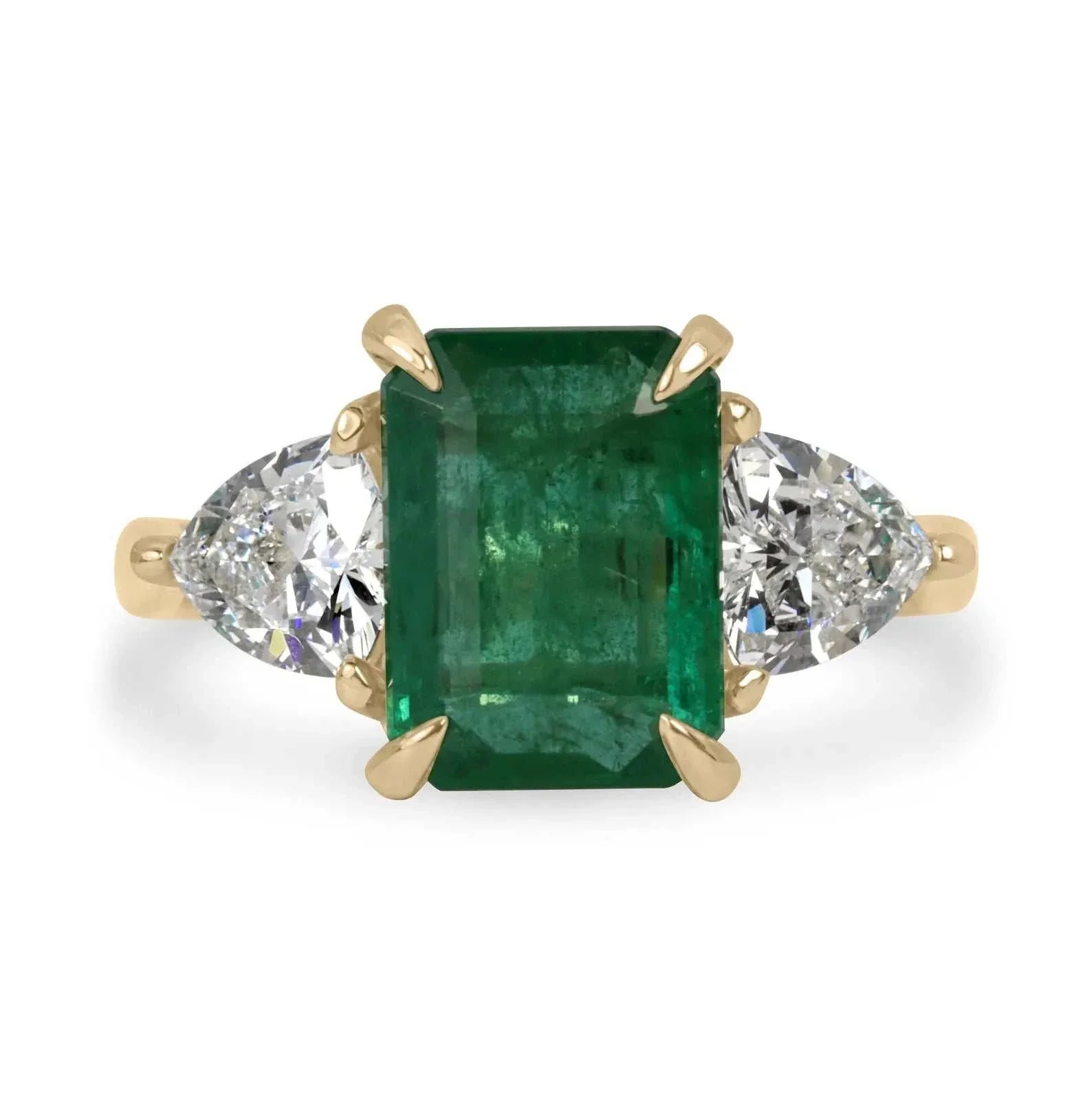 14K yellow gold ring with natural emerald center and trillion-cut lab diamonds on sides