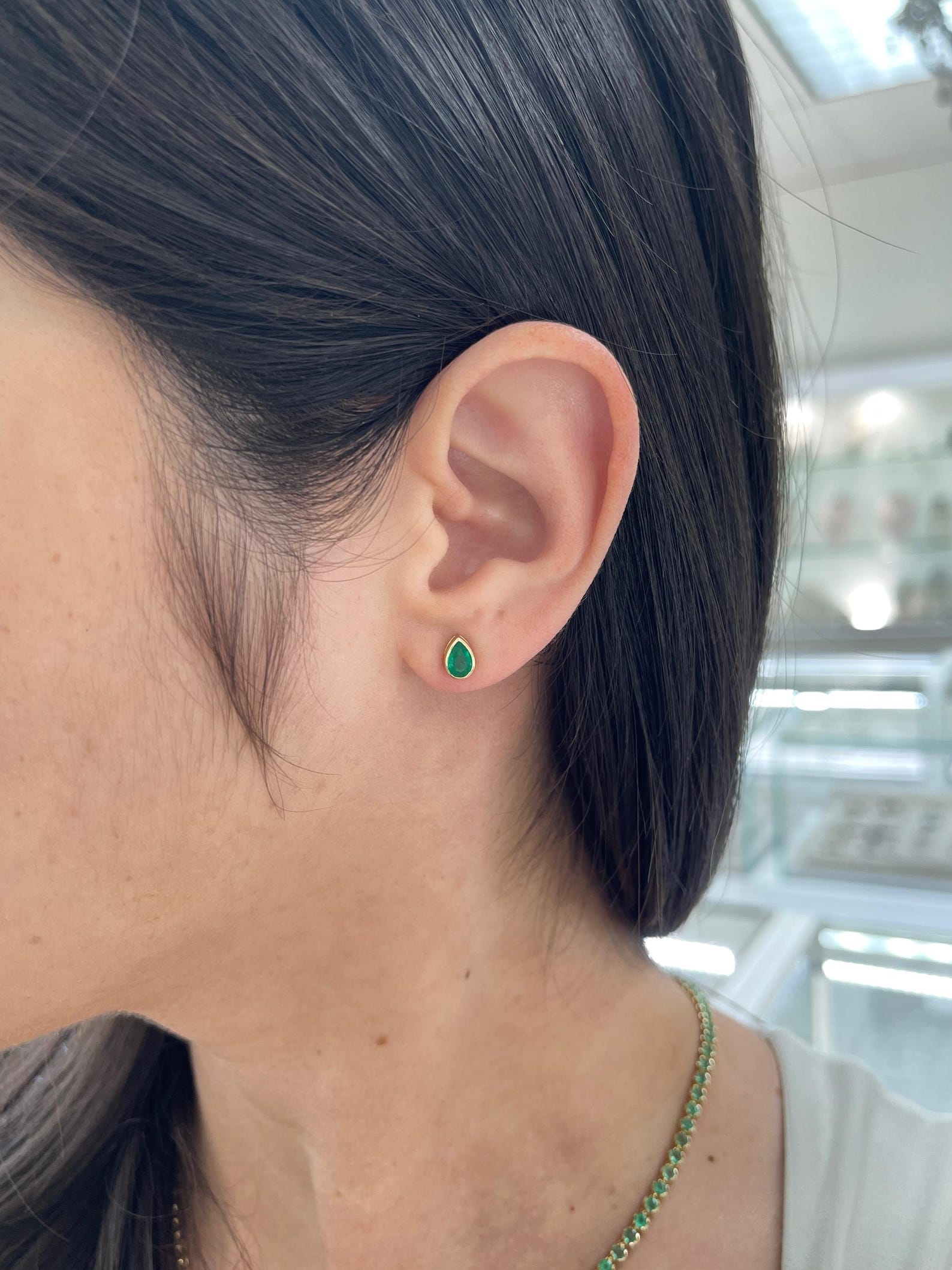 Rich green pear cut Zambian emerald stud earrings with 18K gold bezel setting by JR Colombian Emeralds.