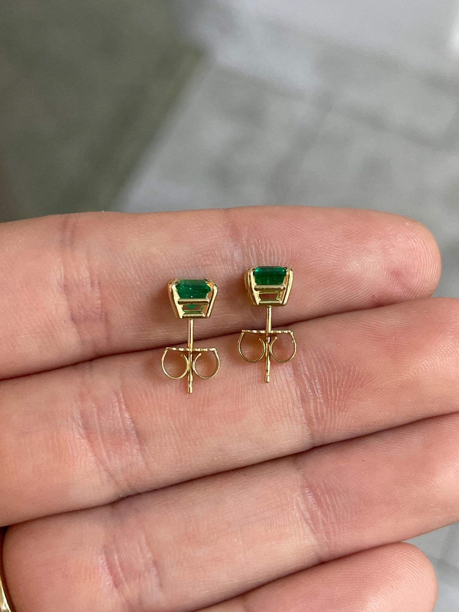 JR Colombian Emeralds 1.46tcw Muzo green asscher cut Colombian emerald stud earrings with four prongs.