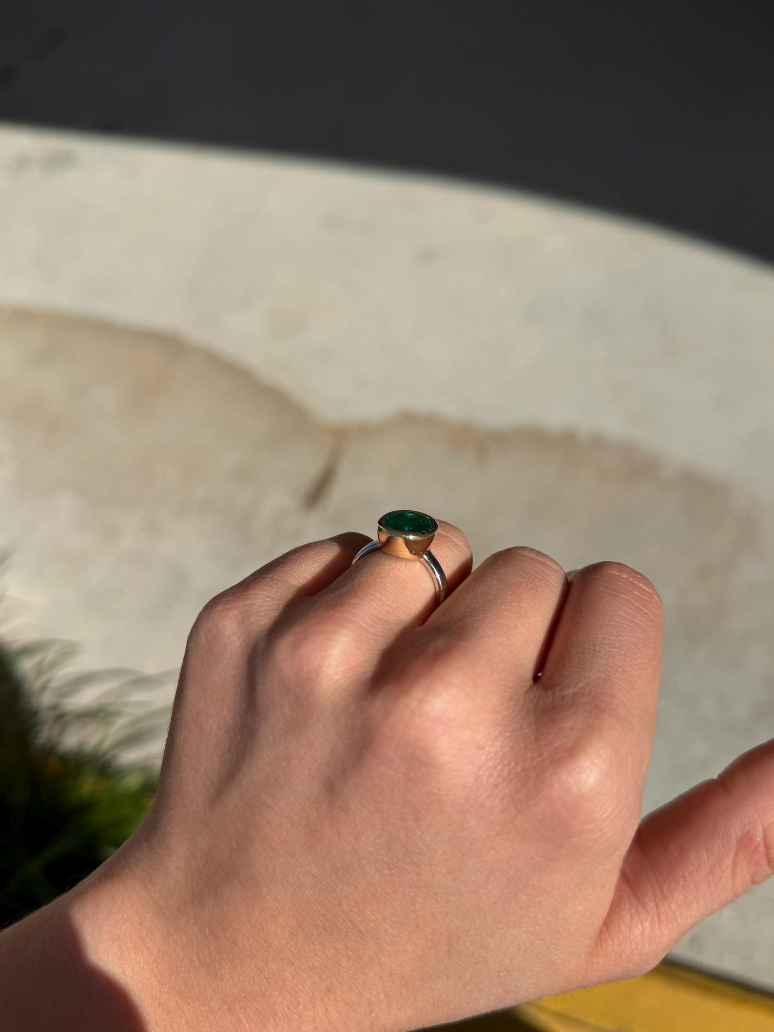 Emerald engagement ring featuring a 3.85 carat oval cut emerald in a two-tone 585 gold bezel setting by JR Colombian Emeralds.