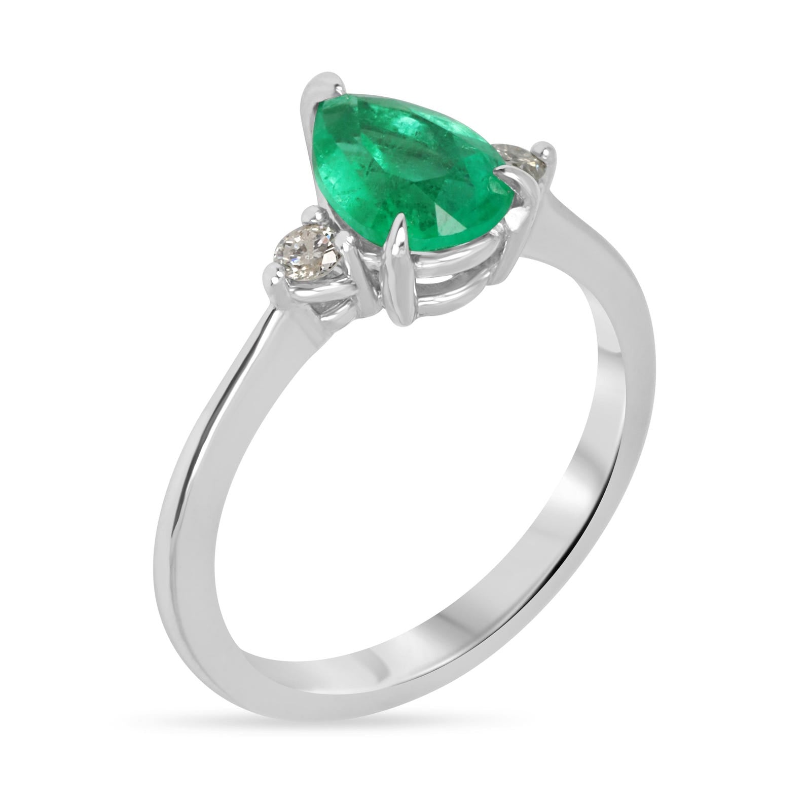 Pear-shaped Colombian emerald three-stone engagement ring with platinum prong setting by JR Colombian Emeralds