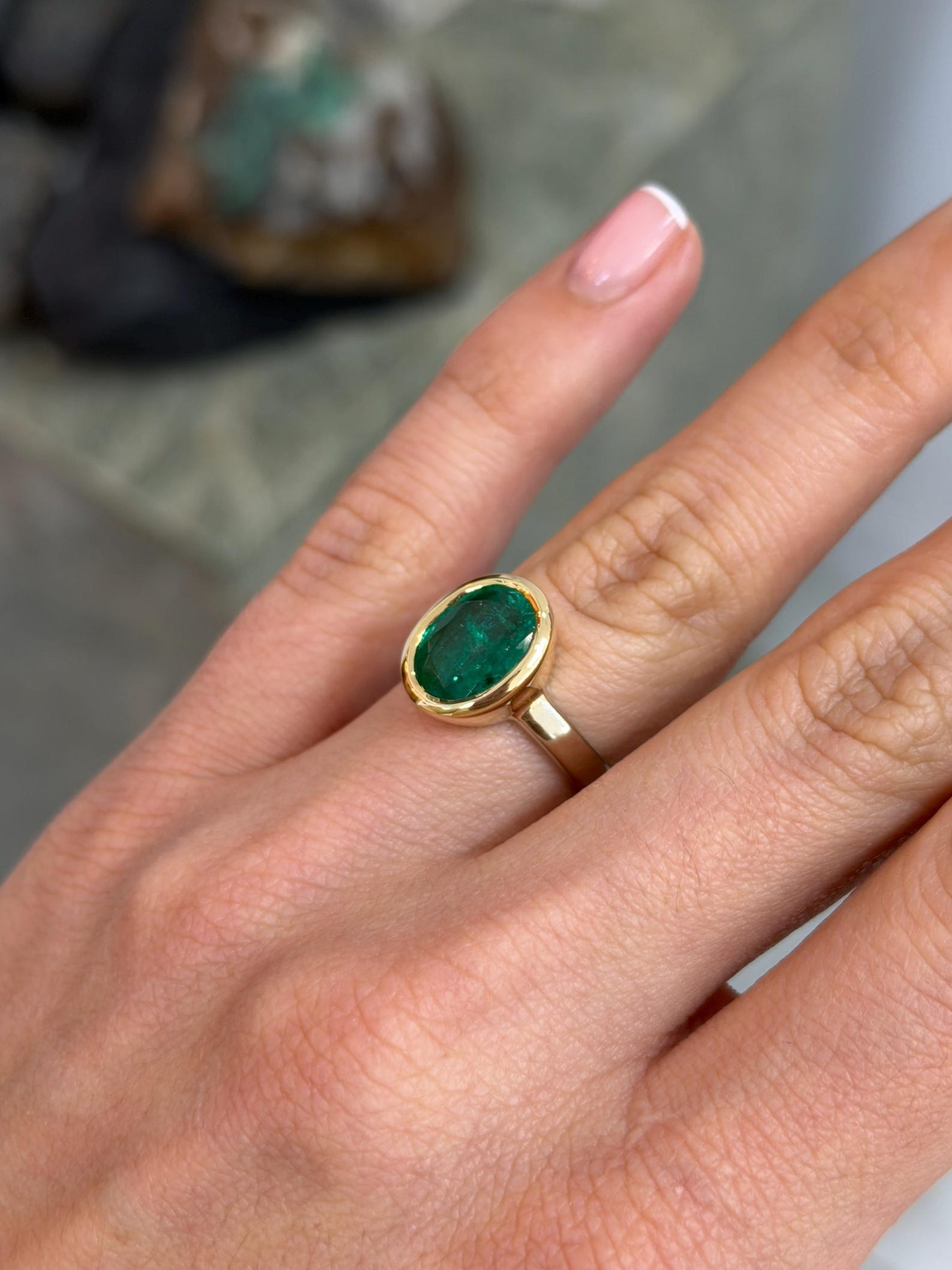 Emerald engagement ring with 3.85 carat oval cut emerald, two-tone gold bezel setting, by JR Colombian Emeralds
