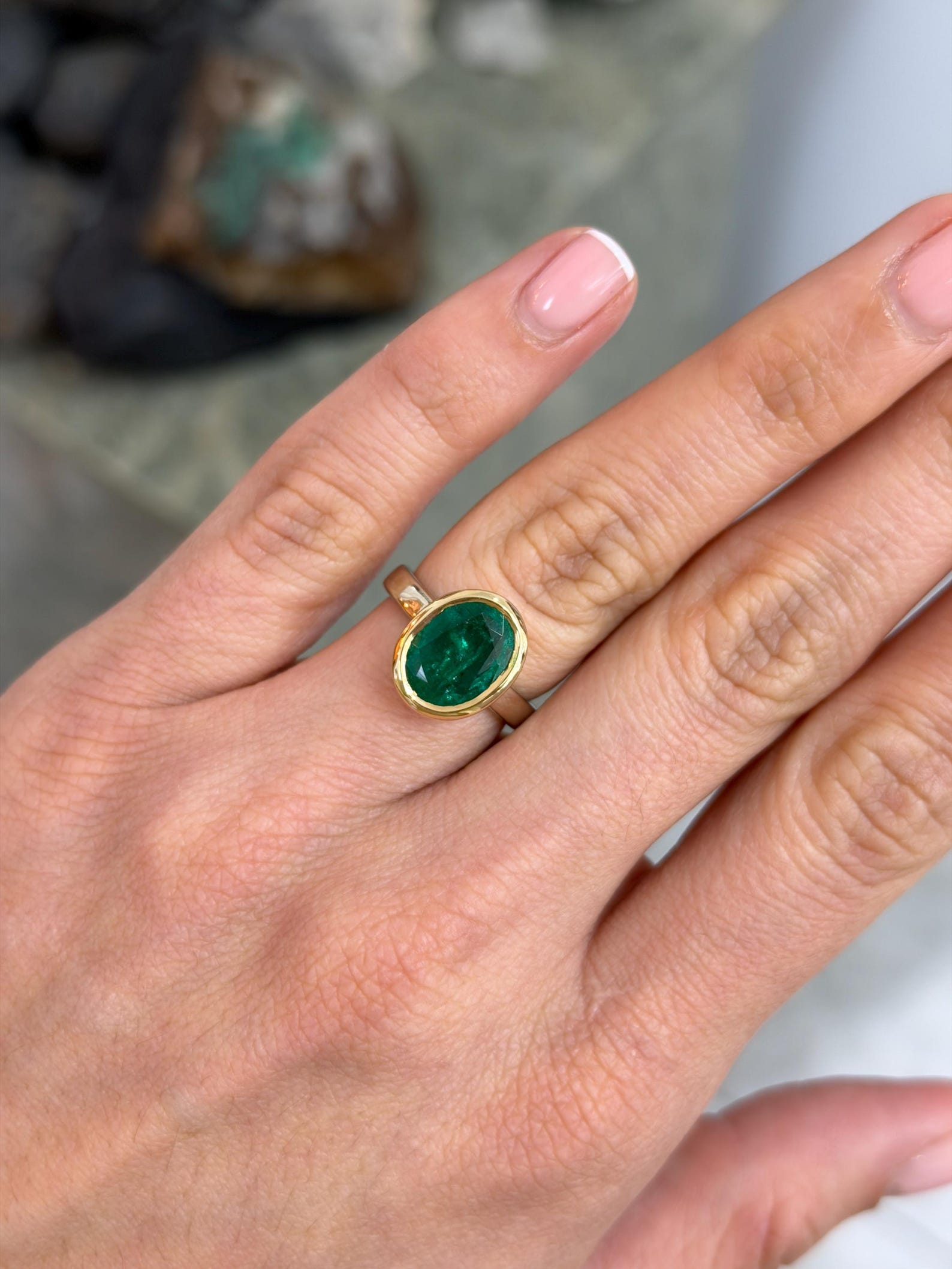 14k two‑toned gold ring with oval cut emerald gemstone bezel set for women