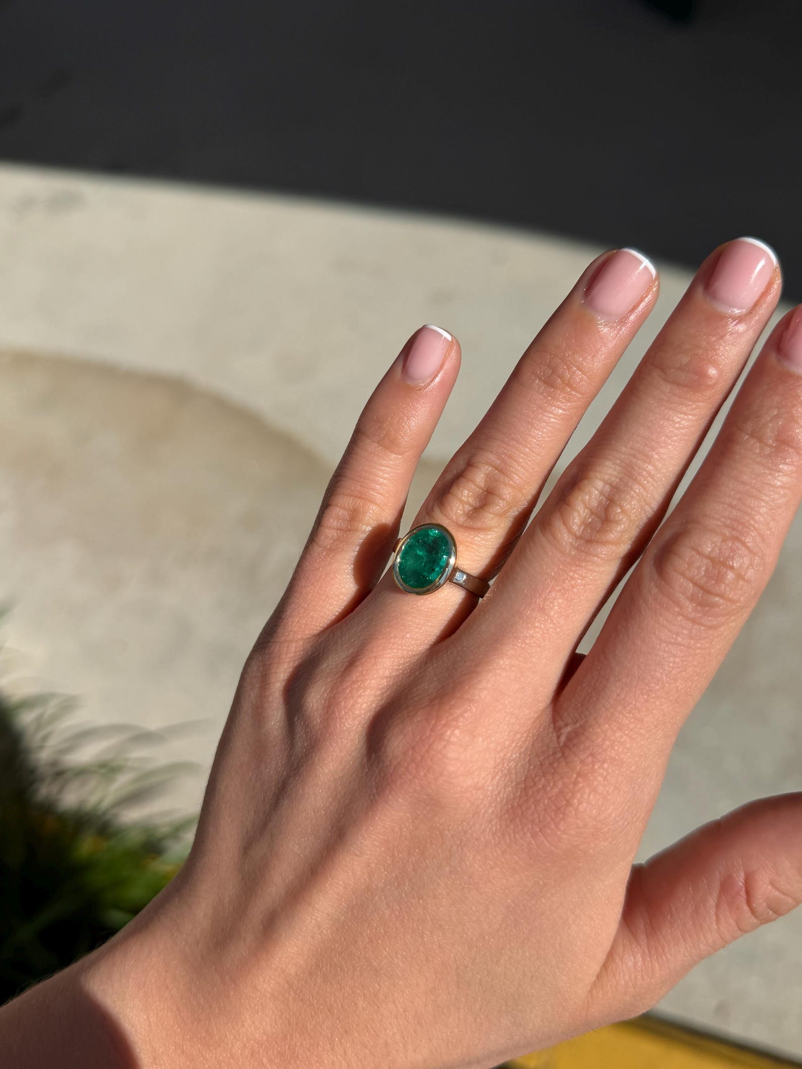 Emerald engagement ring with 3.85 carat oval cut emerald, two-toned bezel set in 585 gold, from JR Colombian Emeralds.