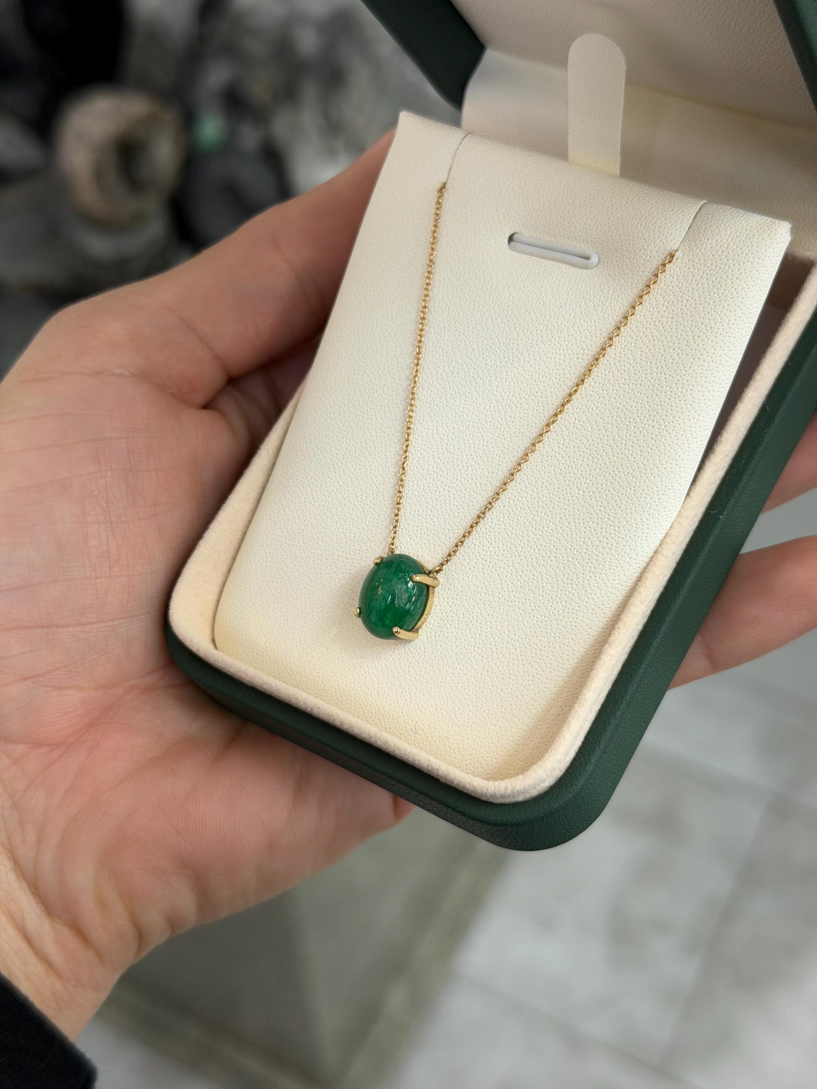Zambian emerald cabochon pendant on 14K gold necklace with prong station setting, jewelry by JR Colombian Emeralds.