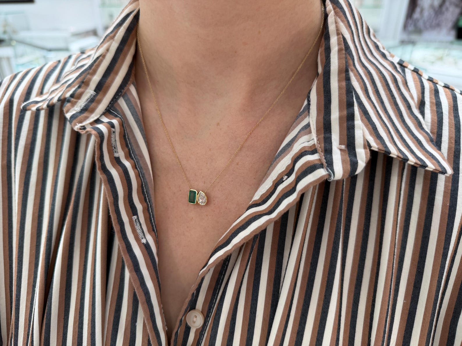 Two emerald moissanite toi et moi pendant necklace with sparkling green gemstones, crafted by JR Colombian Emeralds.