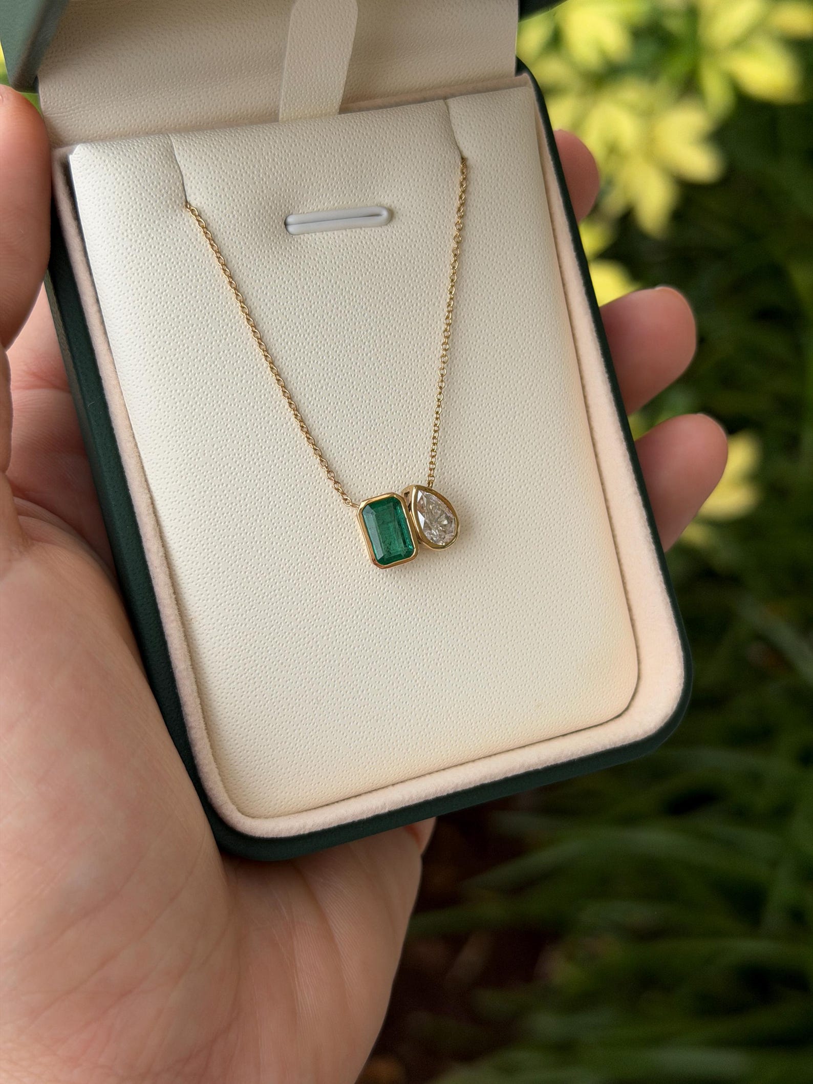 14K gold pendant necklace with two emerald-cut moissanite stones totaling 2.20 carats, elegant jewelry by JR Colombian Emeralds