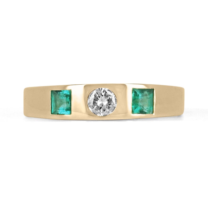 14K yellow gold band ring with vivid green emeralds and a round cut diamond.
